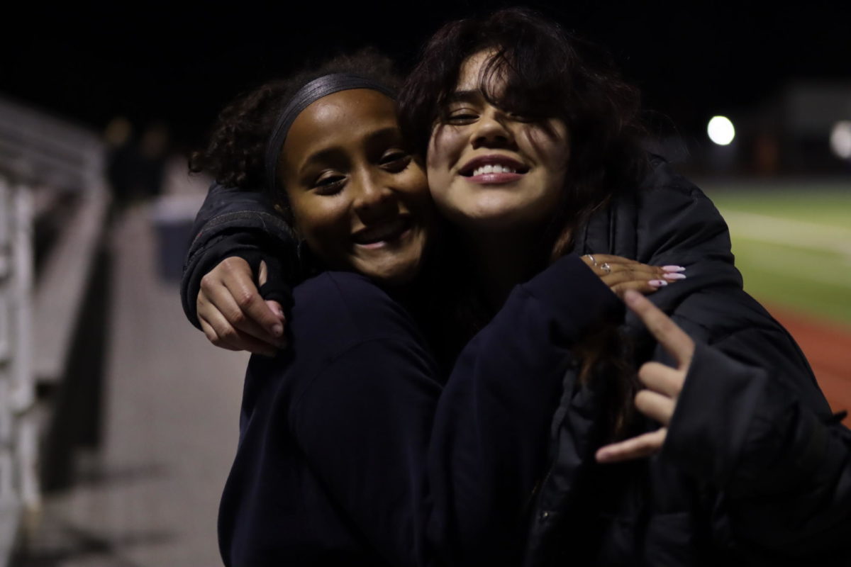 Stronger Together: Jasmine John (12) and Emily Morera (12) are waiting to play their soccer game at South Garland on February 17, 2023 to bring home another win for the season.  They have been practicing everyday after school with their team to be district champions.  With all this time spent together, they have built a strong relationship with one another.