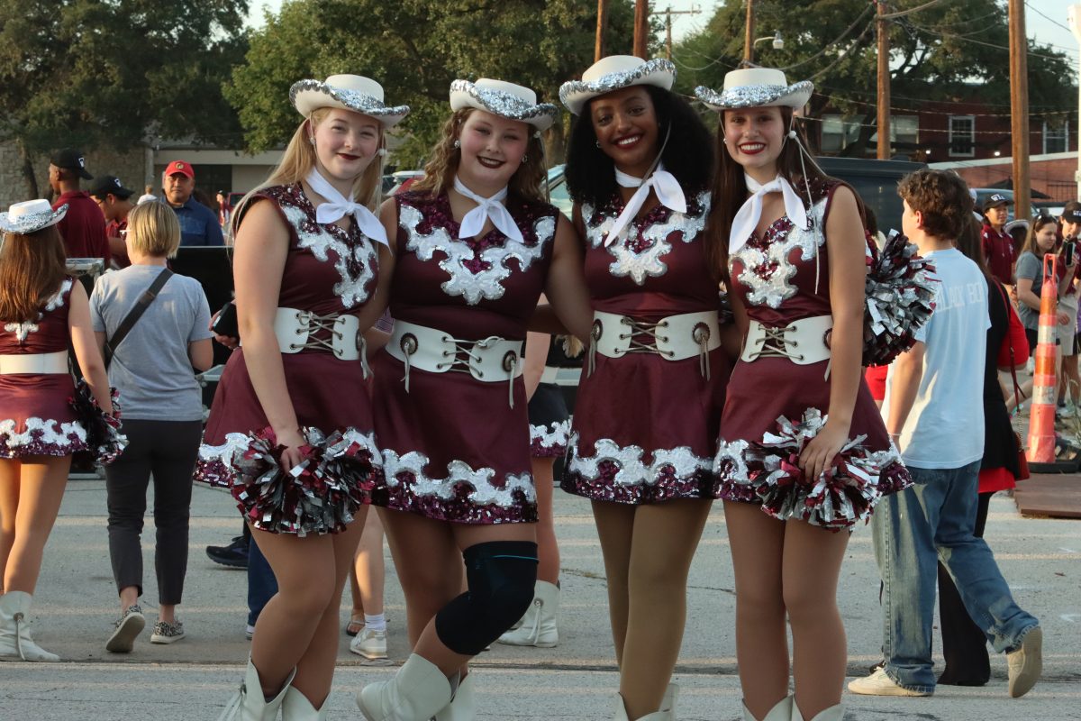 pacesetters posing for the camera at the homecoming parade.