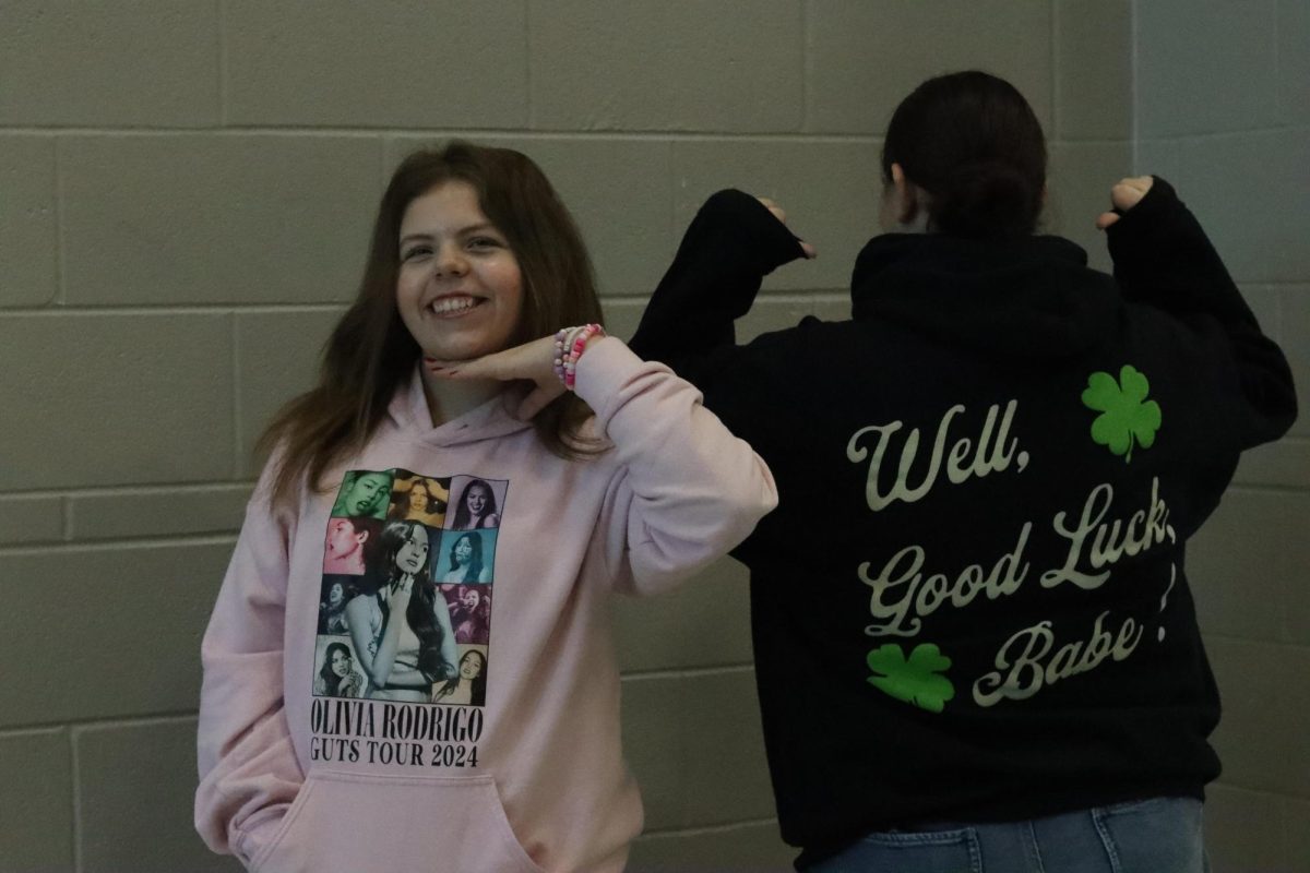 Bella Court and Landry Castricone(me) showing of our fangirl merch. 