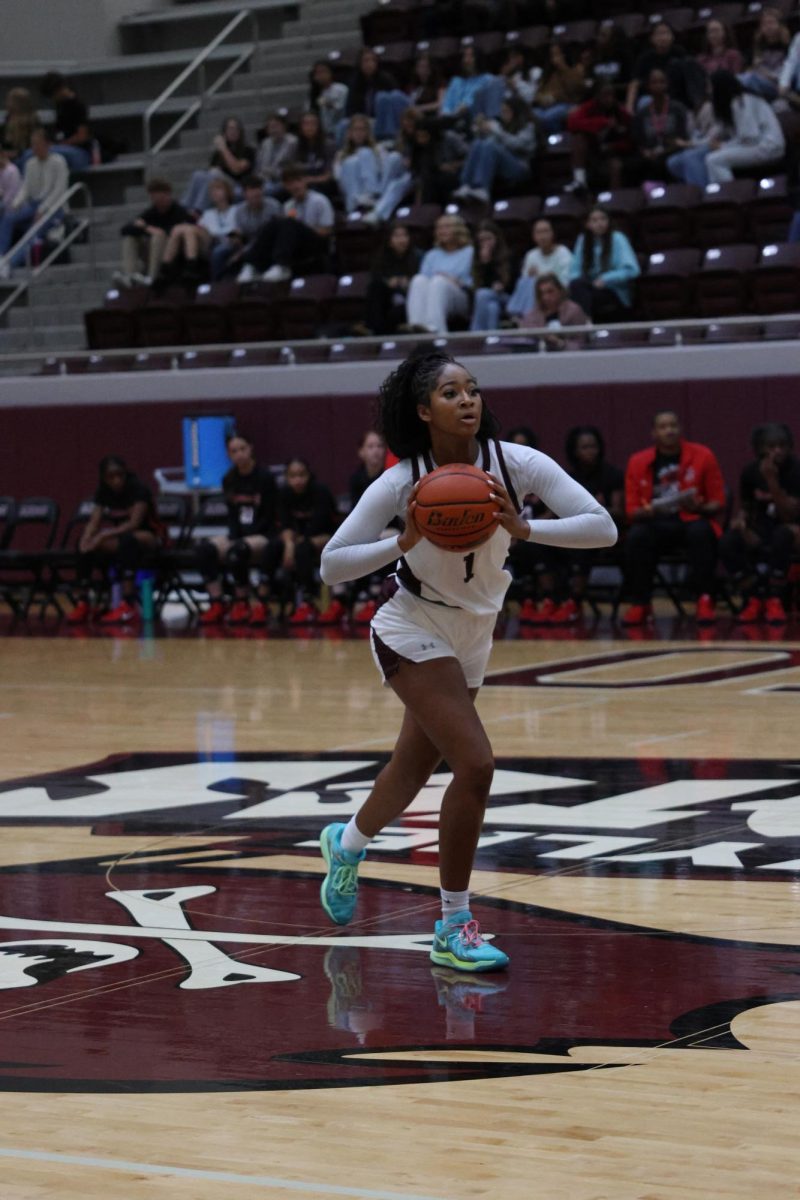 Micah Lovelace (12) playing at the basketball tournament hosted by Wylie High School. 