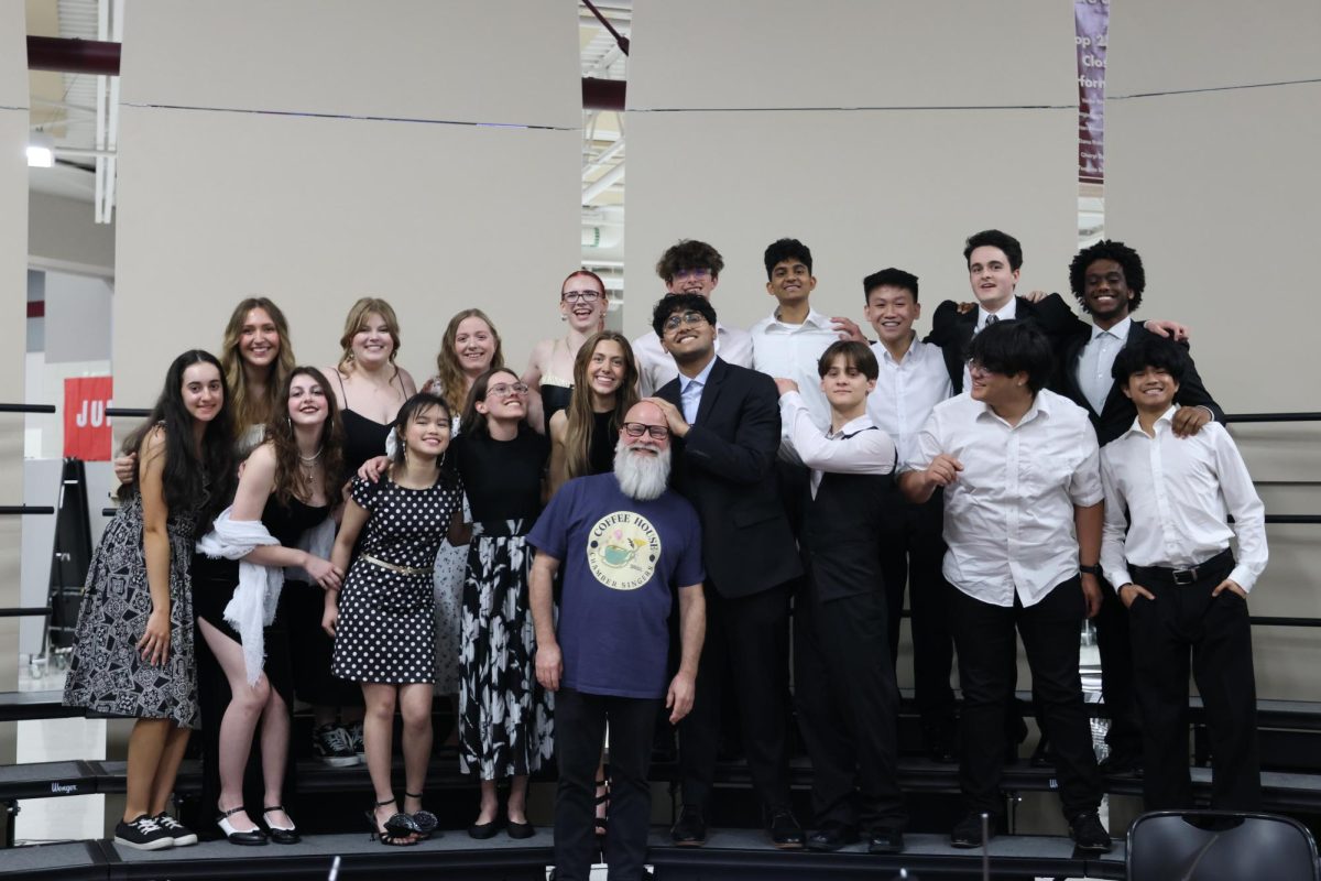 All of the members of Chamber Choir standing with Mr. Bowling.