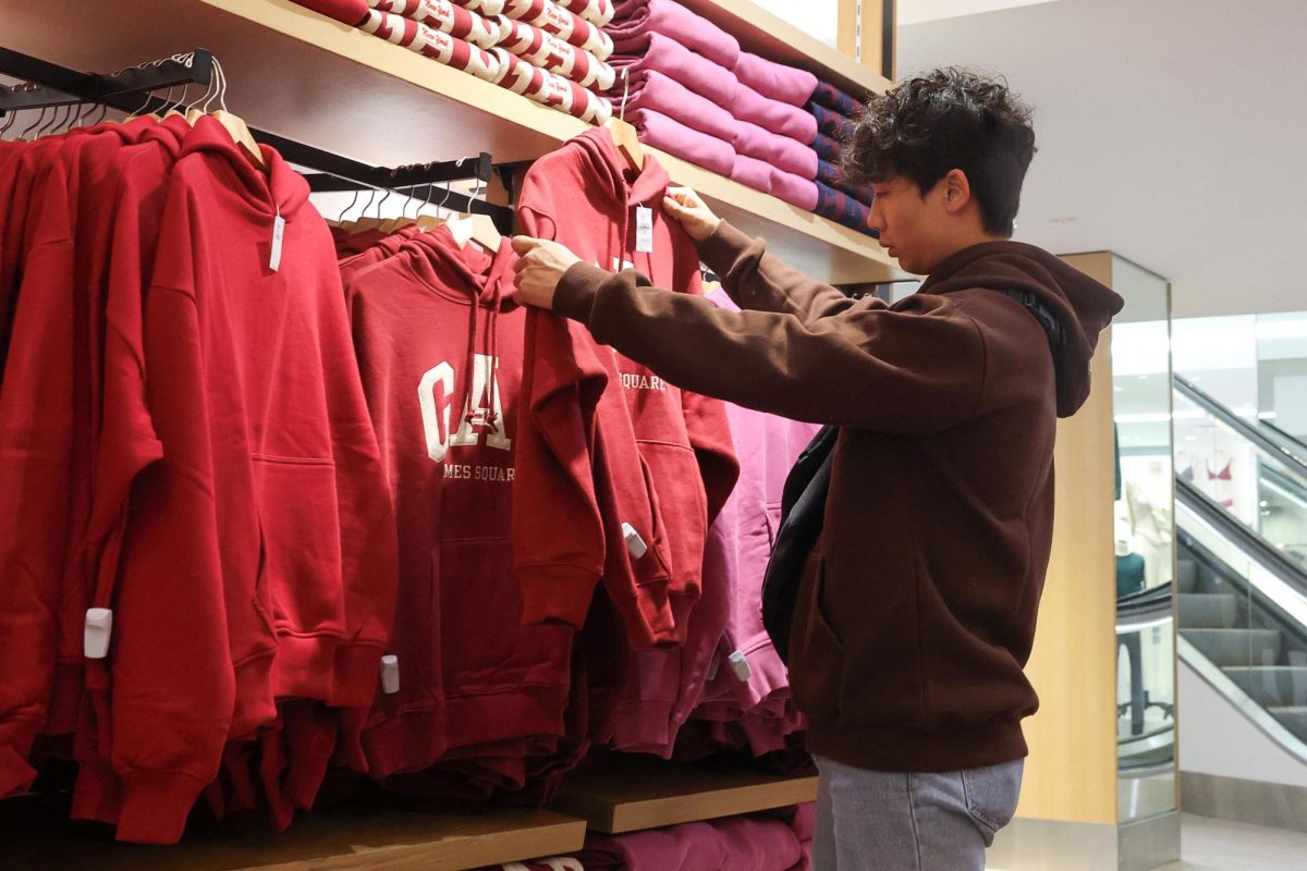 A person shops on Thanksgiving at a Gap store in Times Square in New York City, U.S., November 28, 2024. REUTERS/Brendan McDermid