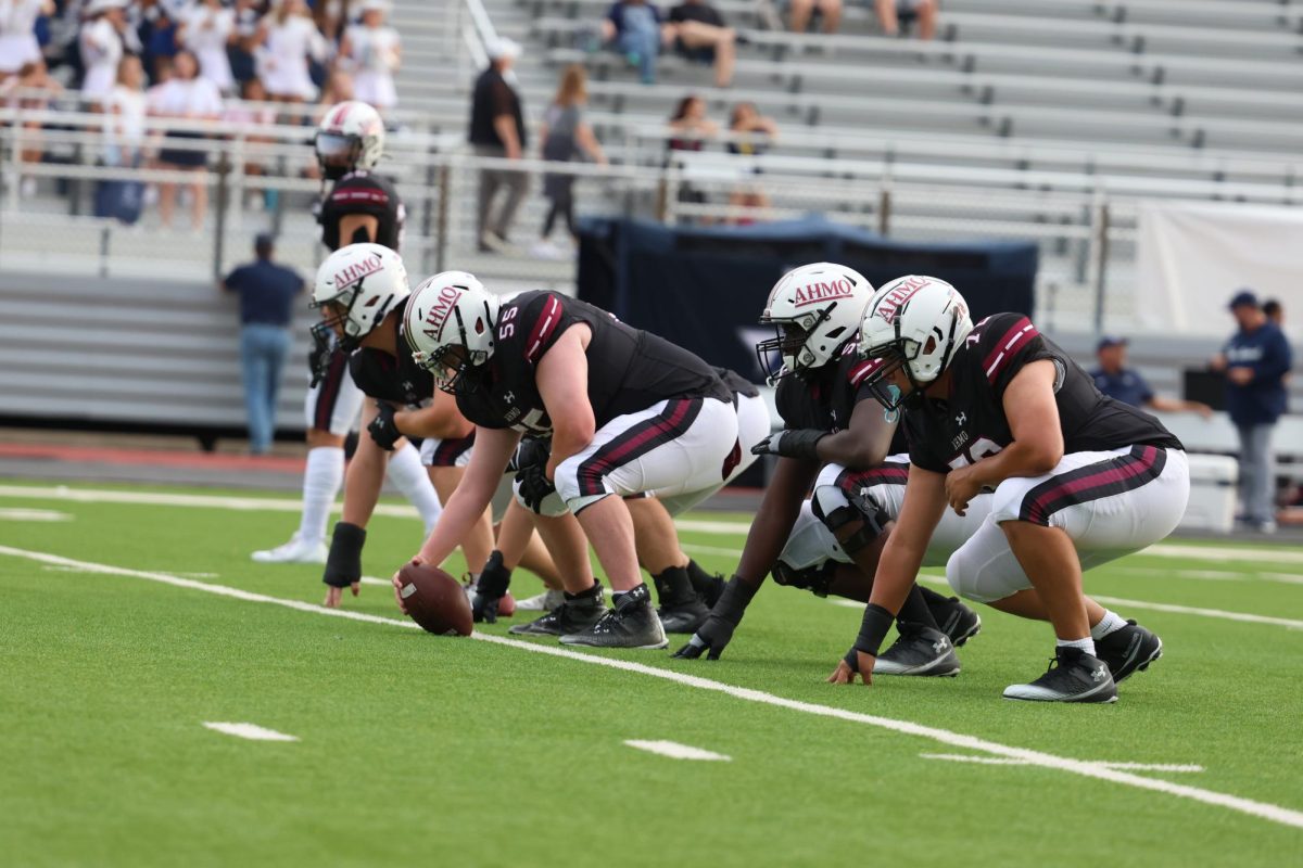 Wylie High School Football players lined up at the line of scrimmage. 