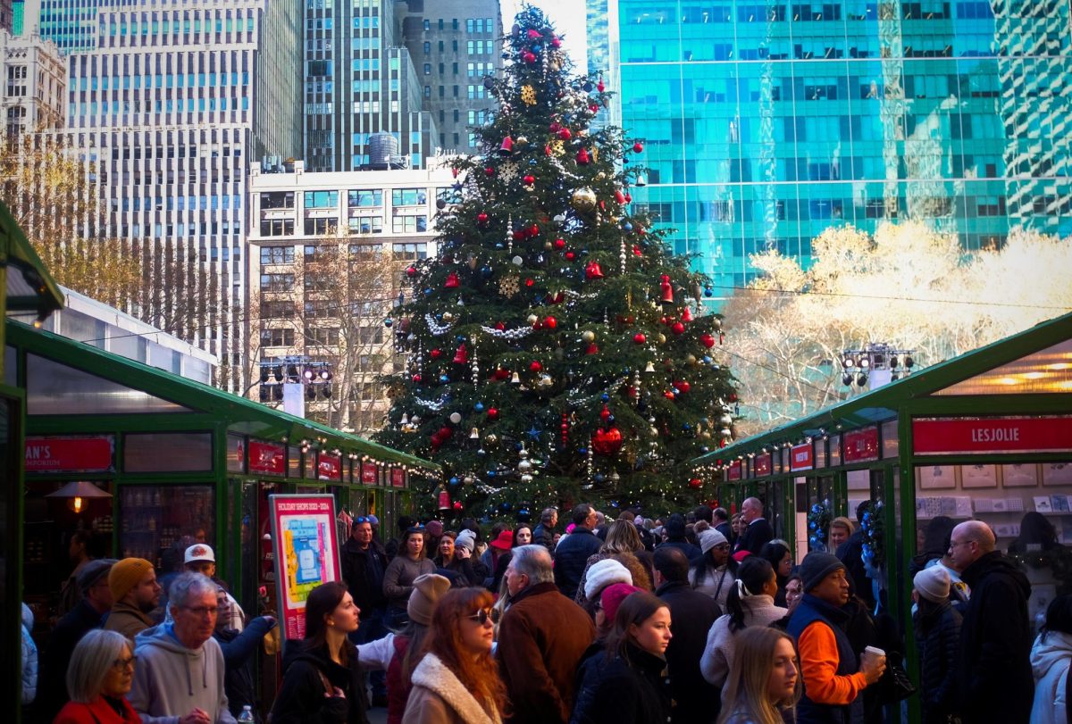 Holiday shoppers pack the seasonal Bryant Park Winter Village beneath a large Christmas tree in midtown Manhattan, in New York City, U.S., December 15, 2023. REUTERS/Mike Segar