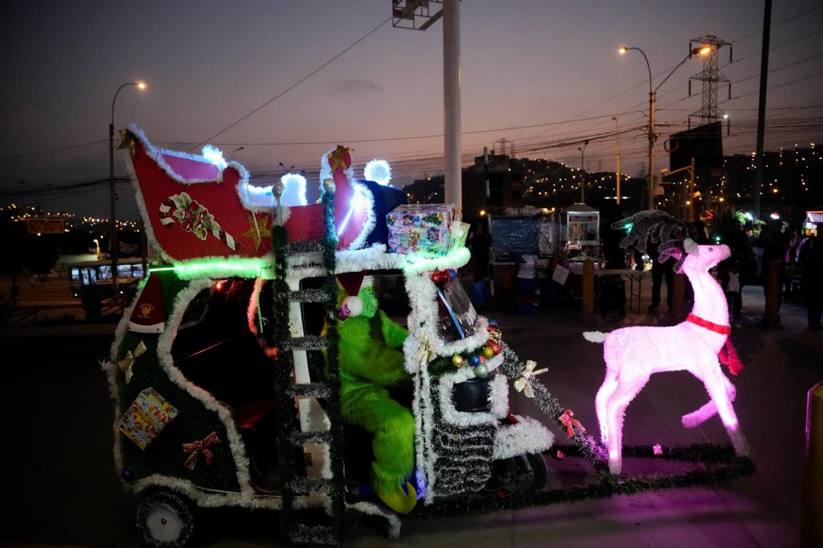 A Peruvian moto-taxi, adorned with festive Christmas decorations to resemble a sleigh, drives through the streets of Lima, spreading seasonal joy as the holiday celebrations draw near, in Lima, Peru, December 12, 2025. REUTERS/Angela Ponce
