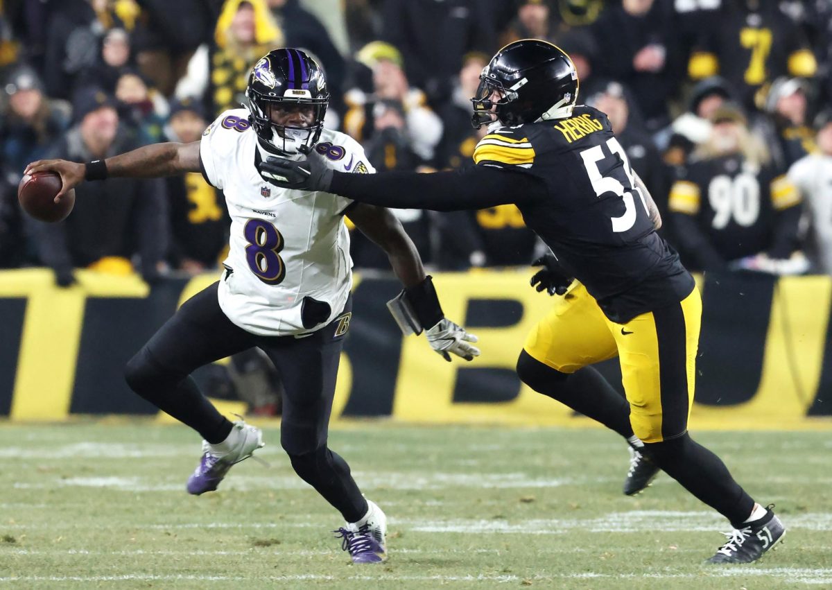 Jan 4, 2026; Pittsburgh, Pennsylvania, USA; Pittsburgh Steelers linebacker Nick Herbig (51) pressures Baltimore Ravens quarterback Lamar Jackson (8) during the second half at Acrisure Stadium. Mandatory Credit: Charles LeClaire-Imagn Images