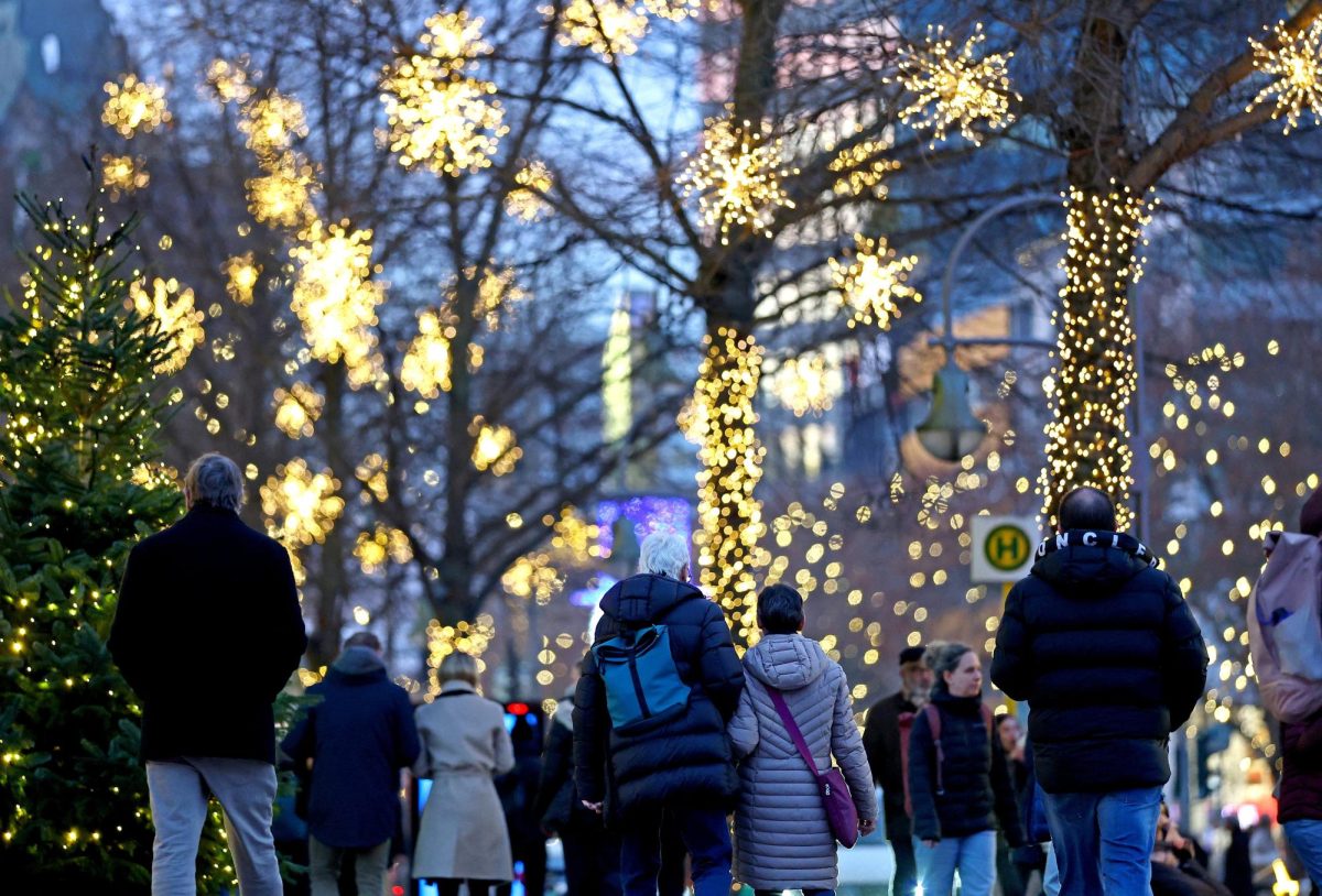 People walk outside the department store Kaufhaus des Westens "KaDeWe" during Christmas season in Berlin, Germany, December 11, 2025. REUTERS/Lisi Niesner
