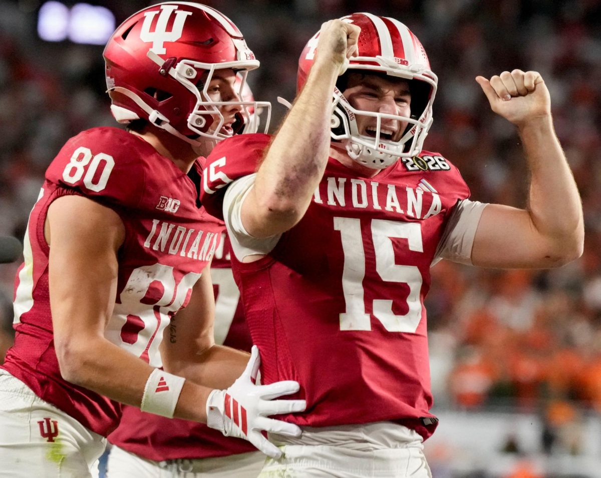 Jan 19, 2026; Miami Gardens, FL, USA; Indiana Hoosiers quarterback Fernando Mendoza (15) celebrates with wide receiver Charlie Becker (80) after scoring a touchdown against the Miami Hurricanes during the second half of the CFP National Championship college football game at Hard Rock Stadium. Mandatory Credit: Grace Hollars-USA TODAY Network via Imagn Images