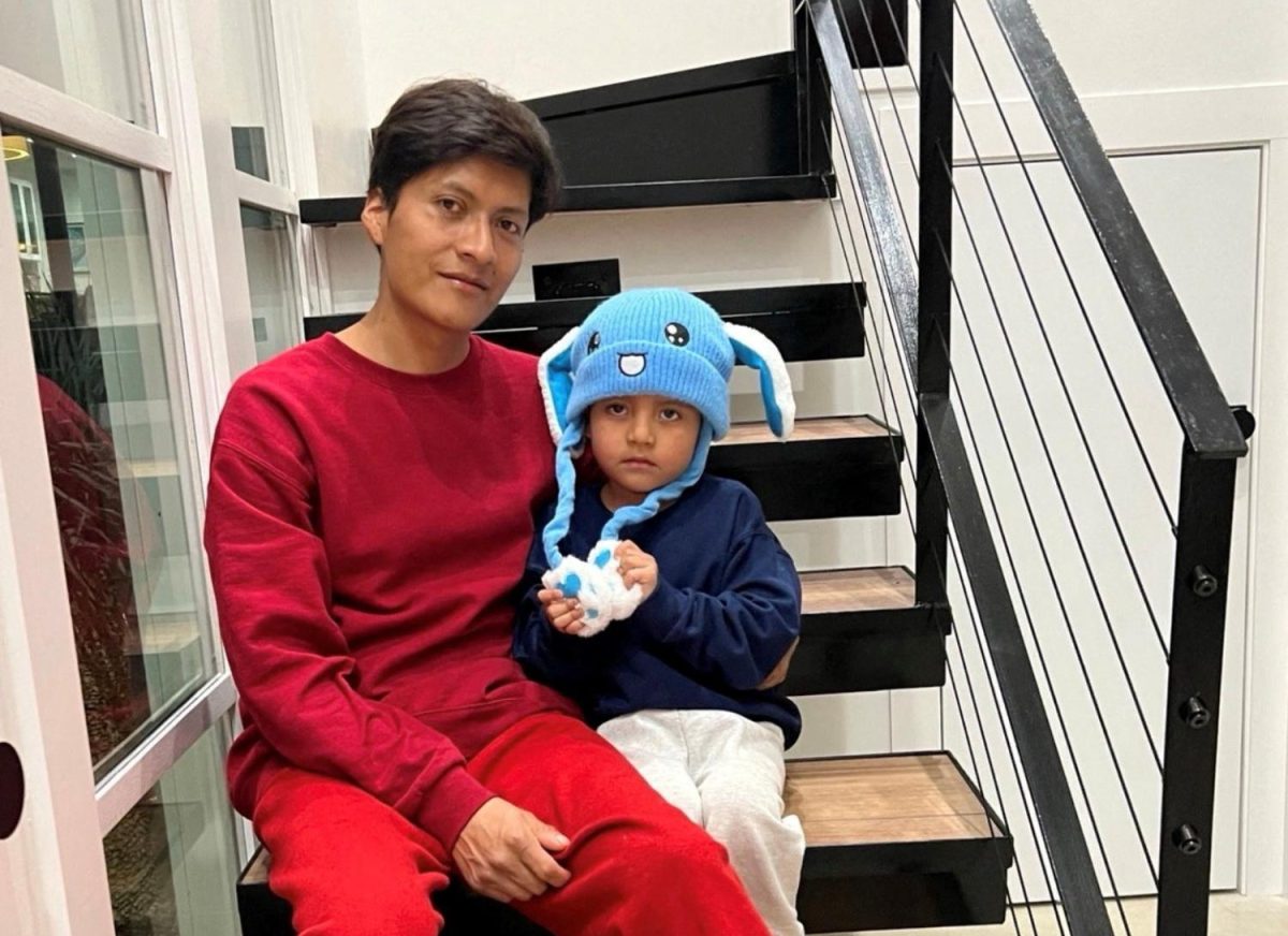 Liam Conejo Ramos and his father Adrian Alexander Conejo Arias, who were detained with his father by immigration officers during a raid in Minnesota and then taken to a detention center in Texas, sit on the stairs back at their home after a judge ordered their release, in Columbia Heights, Minnesota, U.S., in this picture obtained from social media February 1, 2026.   Joaquin Castro via BlueSky/via REUTERS