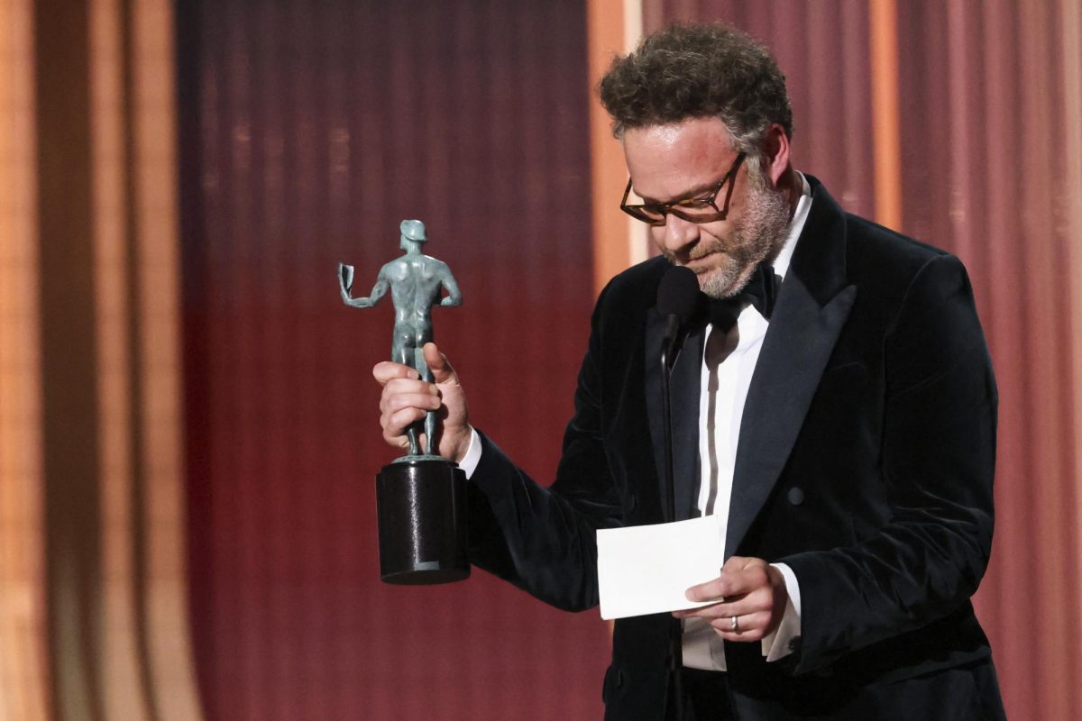 Seth Rogen accepts the Outstanding Performance By A Female Actor In A Comedy Series award on behalf of Catherine O'Hara for "The Studio" during the Actor Awards, in Los Angeles, California, U.S., March 1, 2026. REUTERS/Mario Anzuoni
