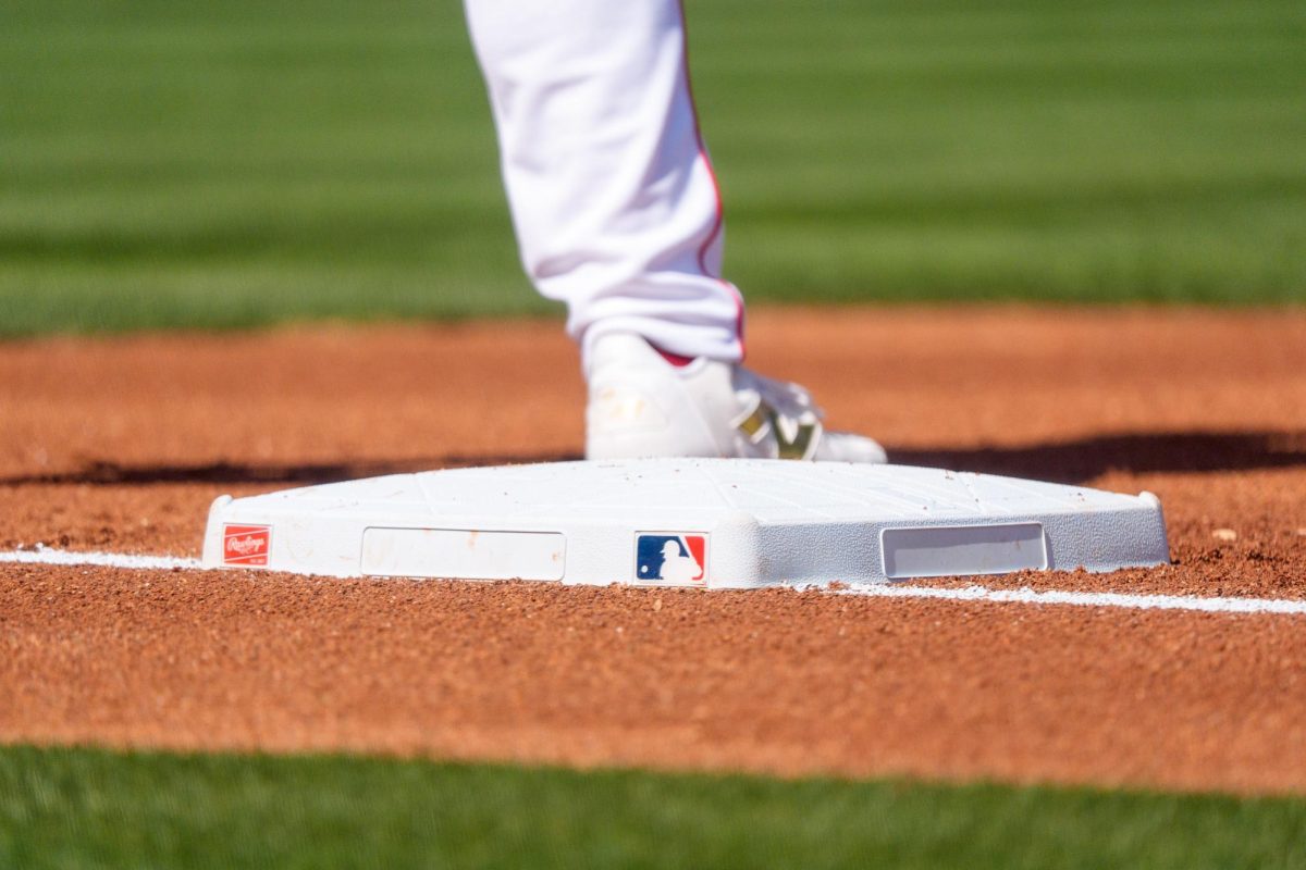 Feb 24, 2026; Tempe, Arizona, USA; Los Angeles Angels A general view of the MLB logo and first base during the first inning of a spring training game between the San Francisco Giants and Los Angeles Angels at Tempe Diablo Stadium. Mandatory Credit: Allan Henry-Imagn Images