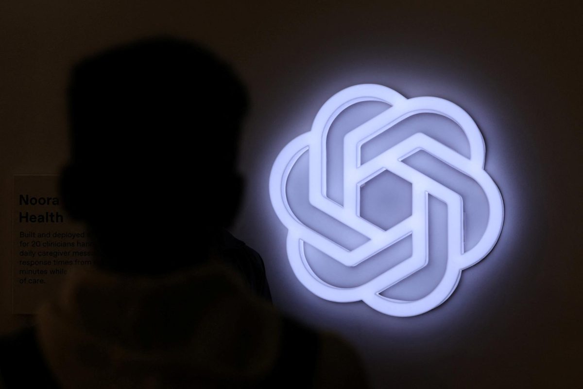 A person stands next to the logo of ChatGPT, an AI-powered chatbot by OpenAI at Bharat Mandapam, one of the venues for AI Impact Summit, in New Delhi, India, February 17, 2026. REUTERS/Bhawika Chhabra