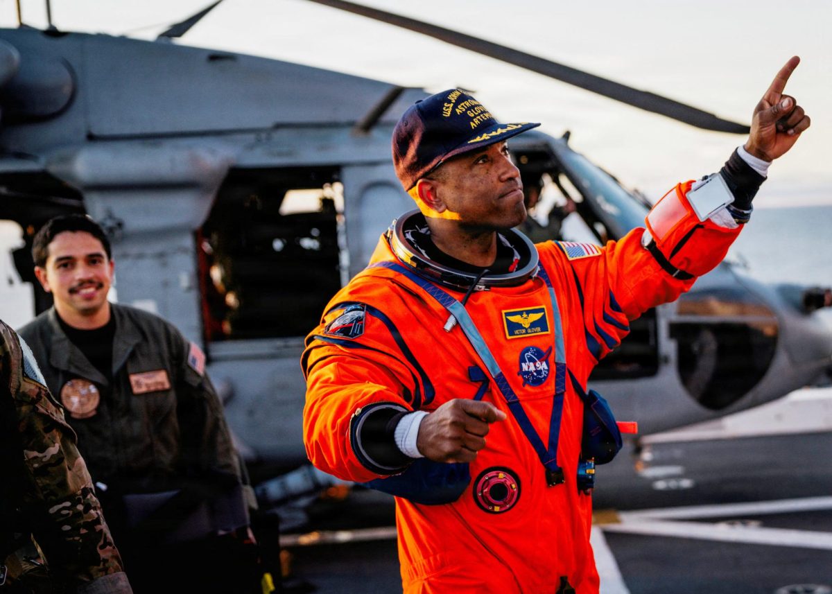 NASA astronaut Victor Glover reacts on the flight deck of the U.S. Navy's USS John P. Murtha after returning from their crew's Artemis II Moon flyby mission's Orion capsule, which splashed down in the Pacific Ocean off the coast of California, U.S., April 10, 2026.   U.S. Navy/Mass Communication Specialist 2nd Class August Clawson/Handout via REUTERS